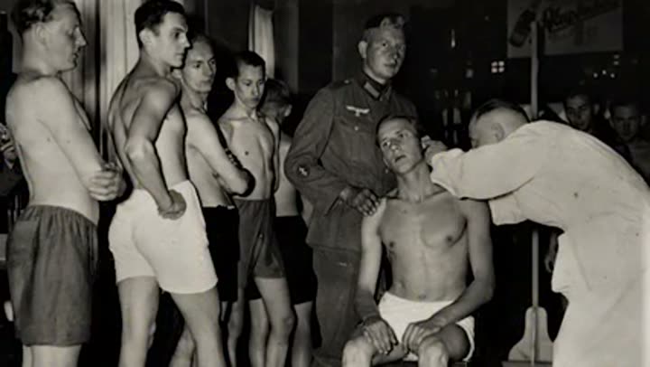 Soldiers undergoing medical examination, representing efforts to engineer the "super soldier."