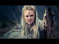 Fierce Viking woman with intricate face markings, embodying Norse permanent art.