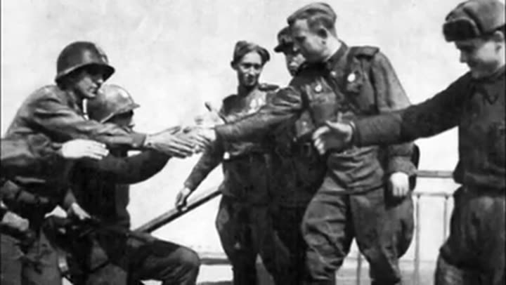 Allied soldiers shake hands, symbolizing the end of World War II and a new era.