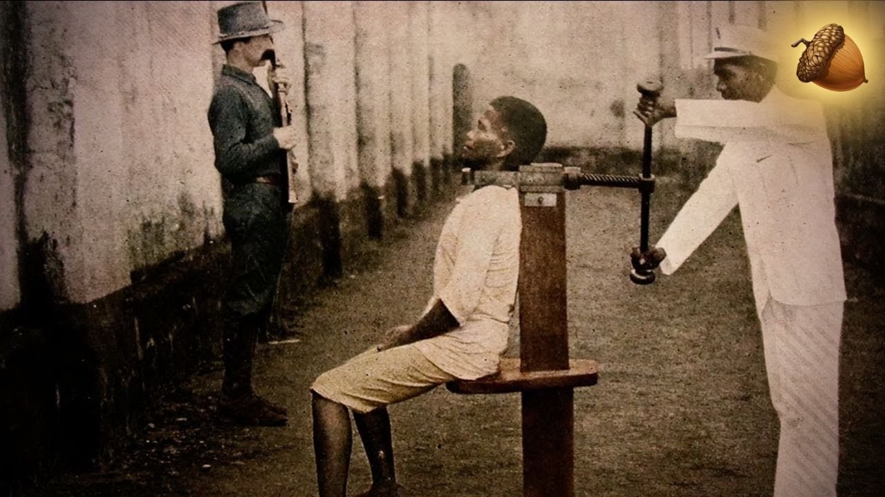 A historical depiction of a prisoner subjected to a head-crushing torture device.
